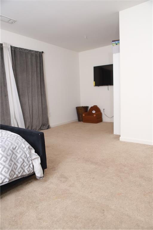 11900 Fuller Street Hampton, GA 30228 - Photo 16 of 17 a bedroom with a bed and a window