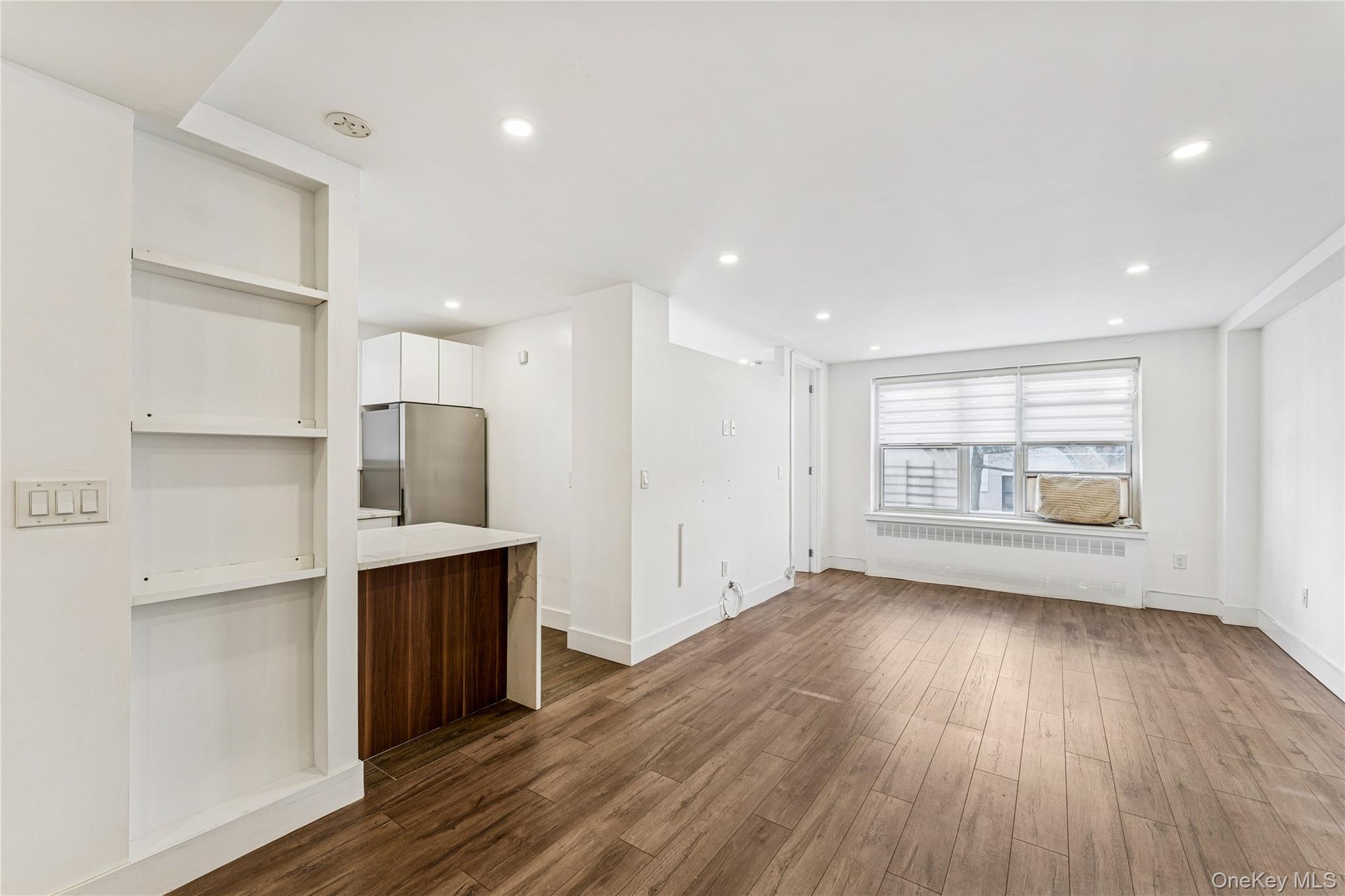 71-36 110th Street, Unit 2F Queens, NY 11375 - Photo 6 of 20 a view of kitchen with a sink refrigerator and window