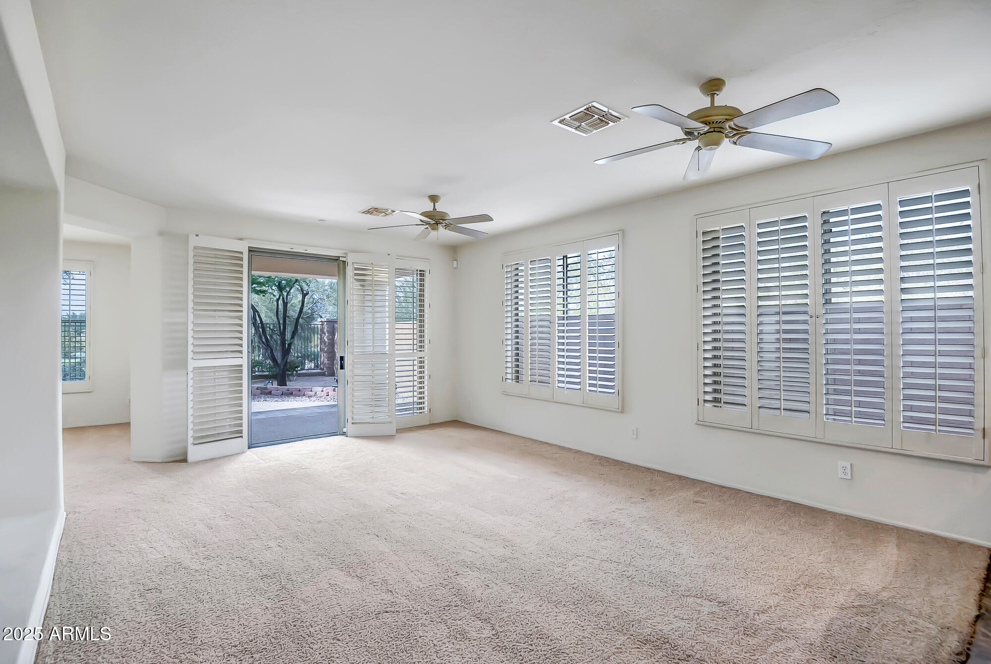 41628 North Cedar Chase Road Anthem, AZ 85086 - Photo 16 of 36 a view of a livingroom with a ceiling fan and window