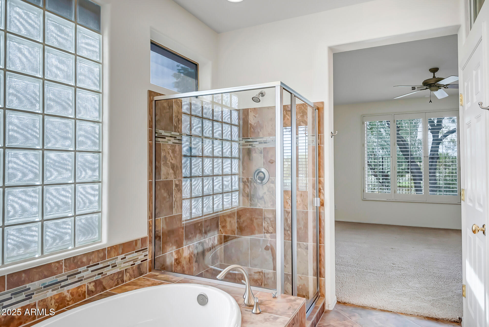 41628 North Cedar Chase Road Anthem, AZ 85086 - Photo 23 of 36 a bathroom with a bathtub and a shower