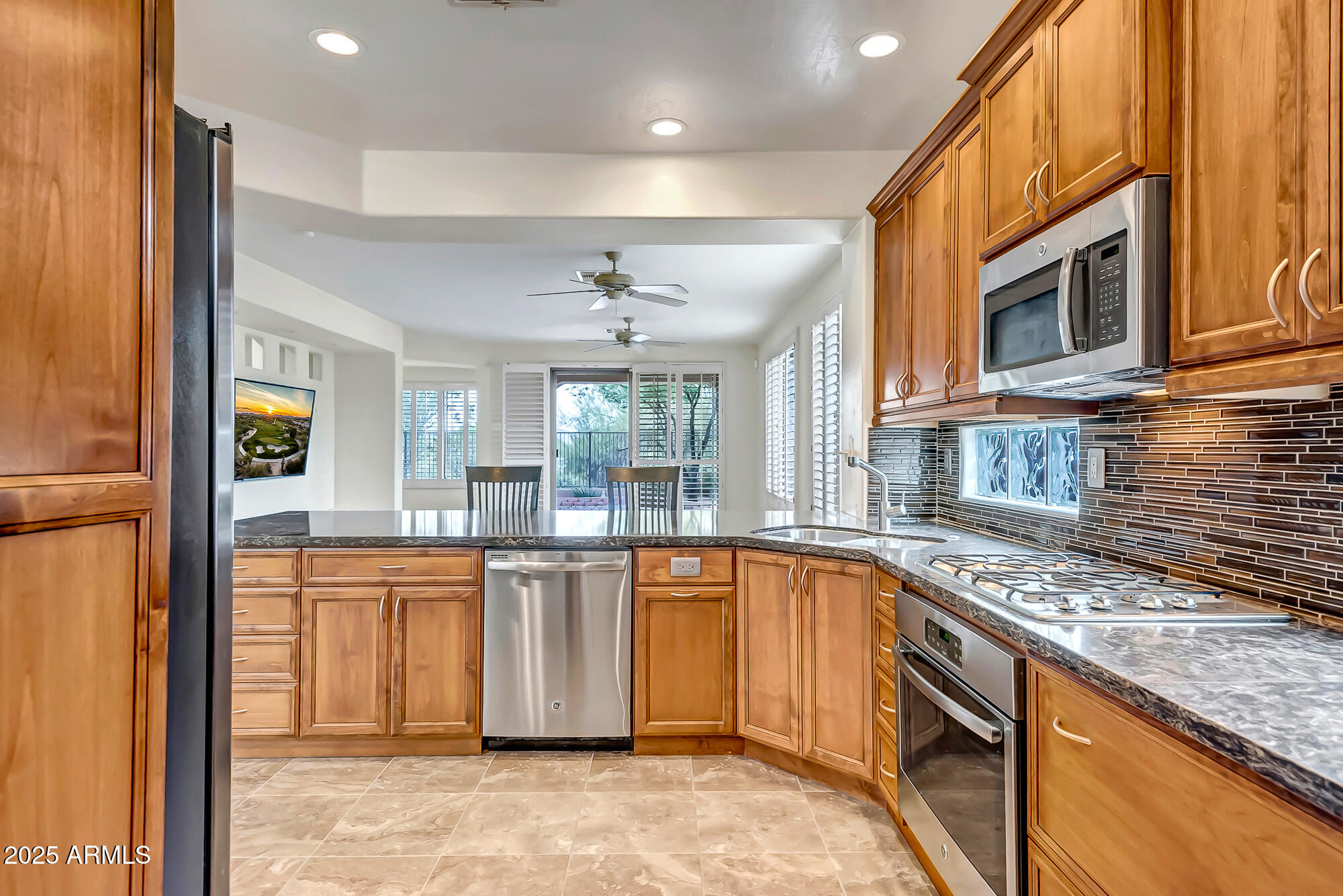 41628 North Cedar Chase Road Anthem, AZ 85086 - Photo 8 of 36 a kitchen with stainless steel appliances granite countertop a sink and cabinets
