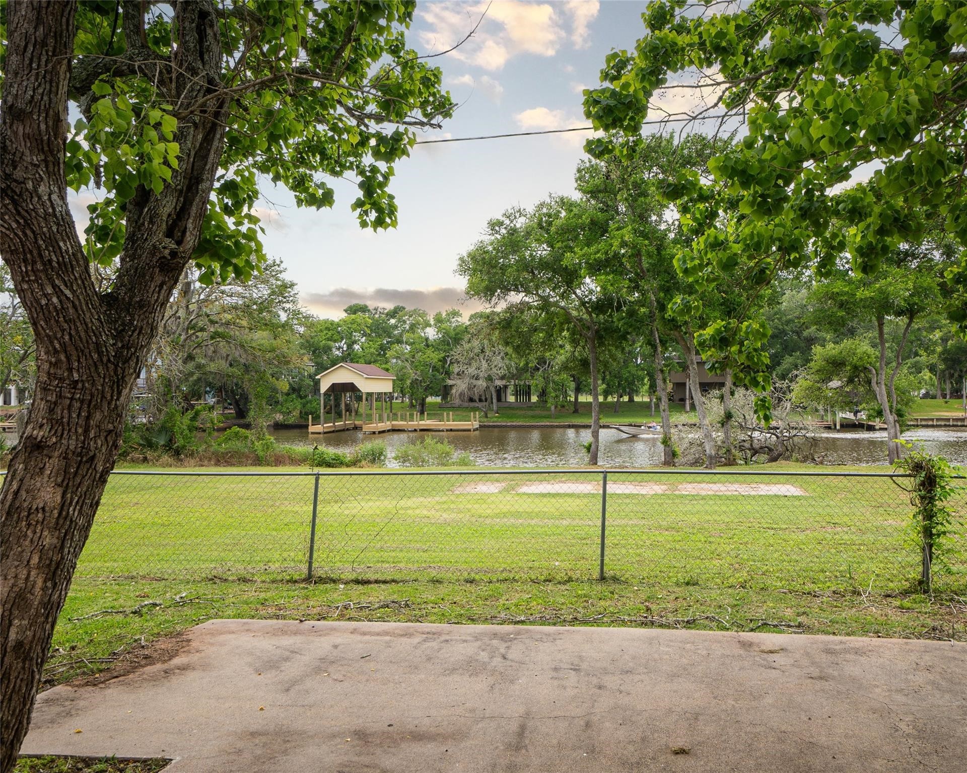 357 County Road 296 Sargent, TX 77414 - Photo 20 of 22 a view of a swimming pool with a yard and large trees