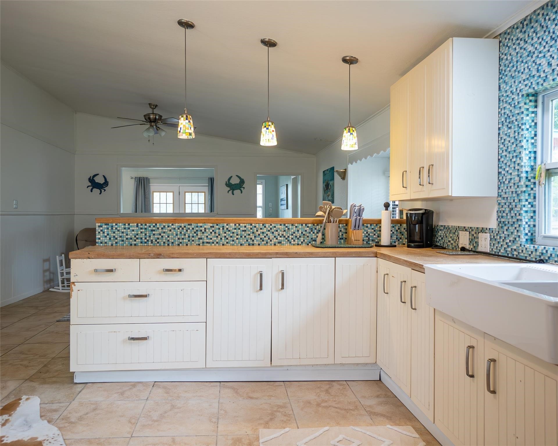 357 County Road 296 Sargent, TX 77414 - Photo 8 of 22 a kitchen with white cabinets and window