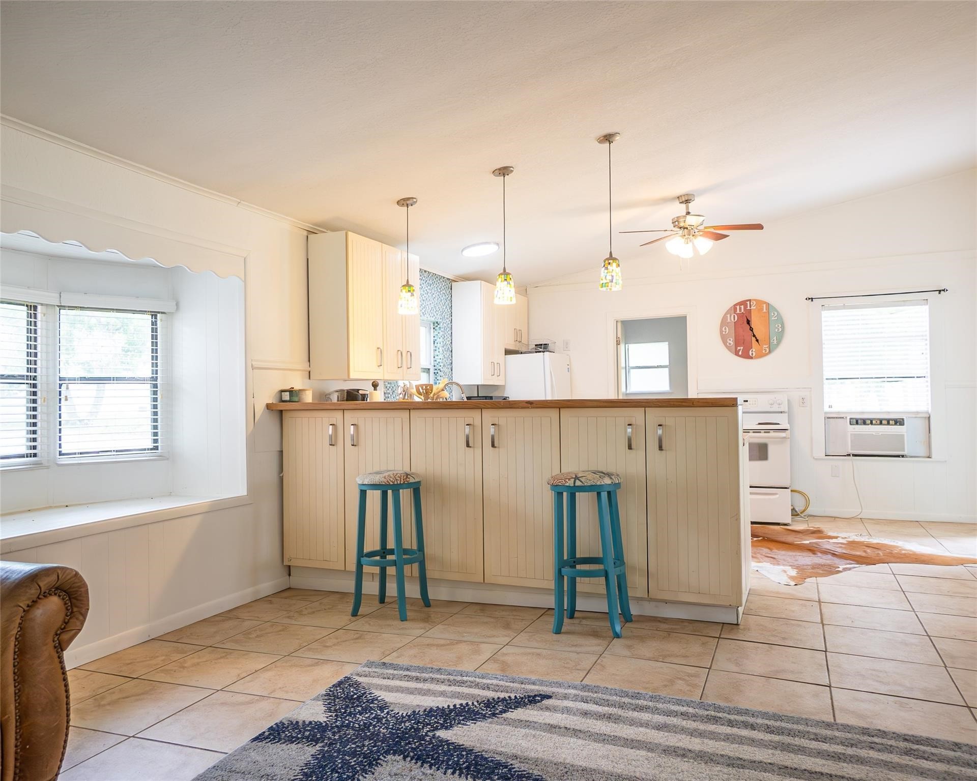 357 County Road 296 Sargent, TX 77414 - Photo 9 of 22 a view of a kitchen with kitchen island granite countertop living room