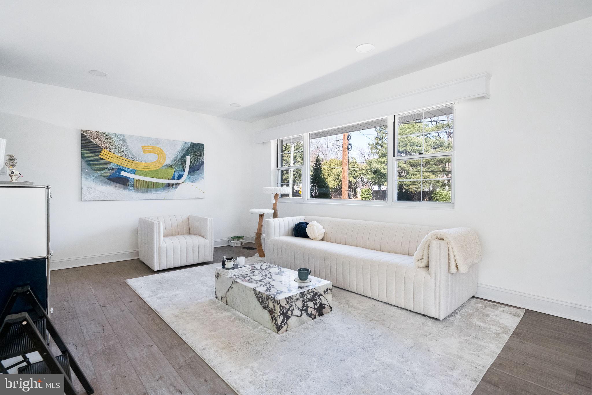 5020 River Road Bethesda, MD 20816 - Photo 11 of 35 a living room with furniture and a large window