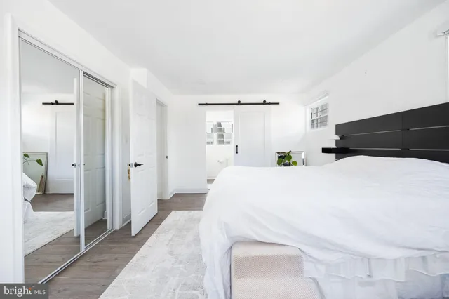 a large white bed in a white room