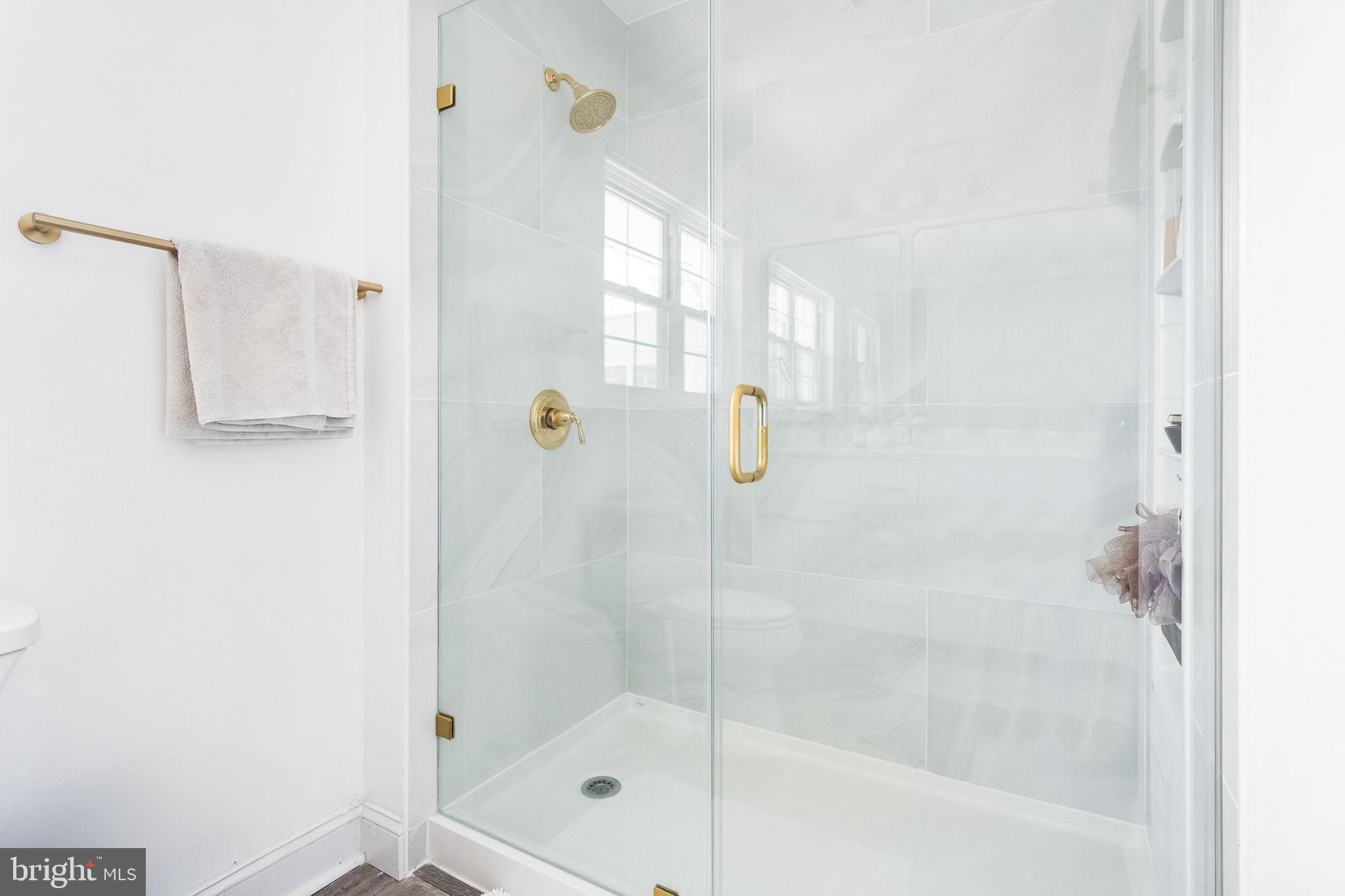 5020 River Road Bethesda, MD 20816 - Photo 15 of 35 a bathroom with a shower