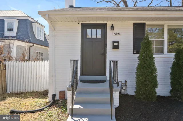 a view of a house with a door and glass door