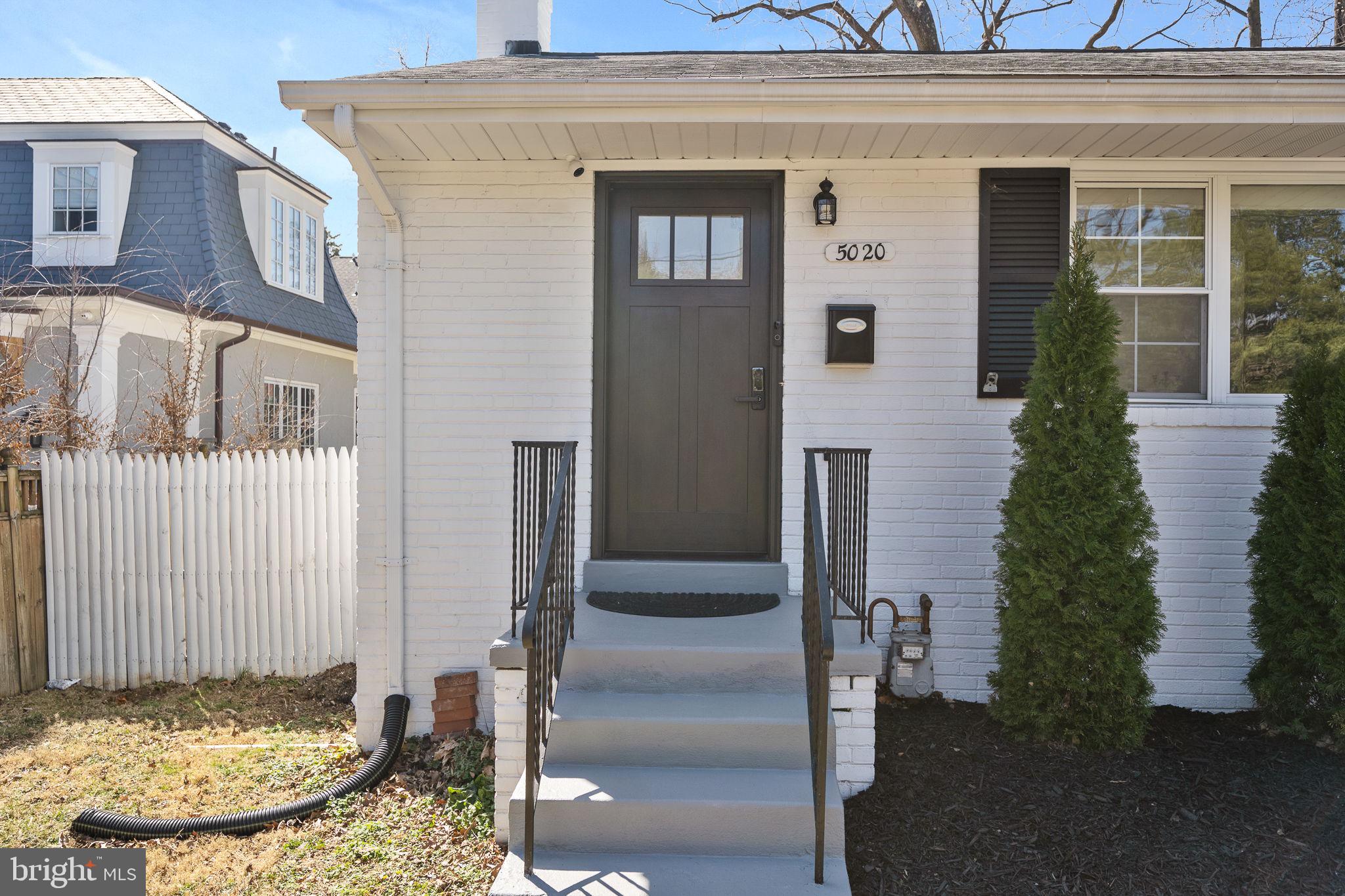 5020 River Road Bethesda, MD 20816 - Photo 2 of 35 a view of a house with a door and glass door
