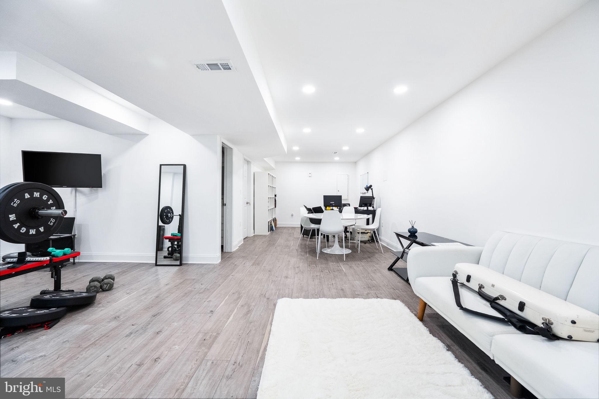 5020 River Road Bethesda, MD 20816 - Photo 23 of 35 a living room with furniture and a flat screen tv