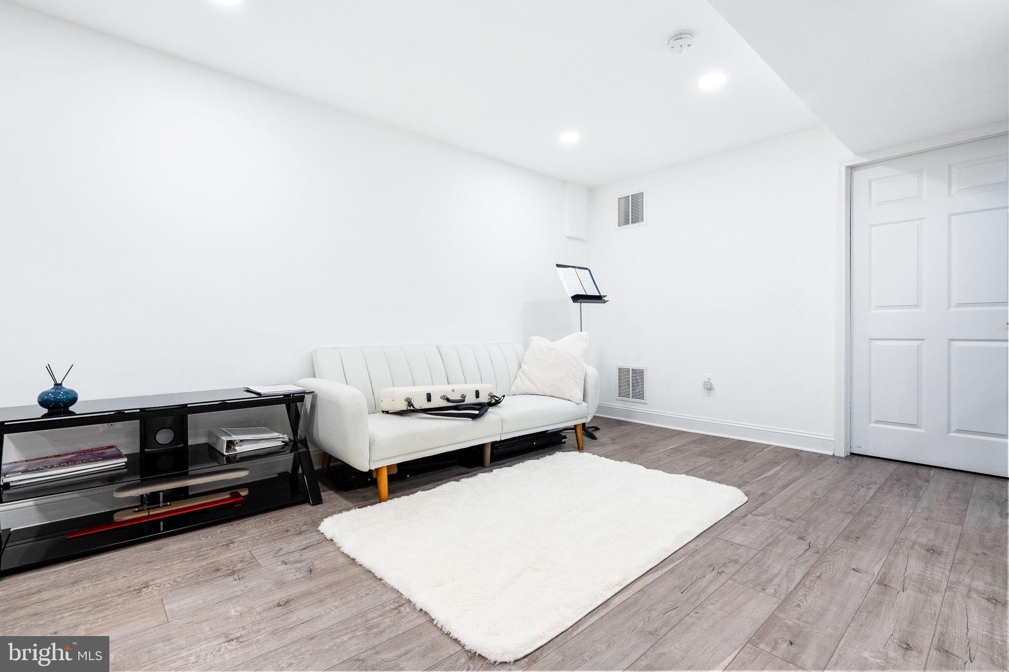 5020 River Road Bethesda, MD 20816 - Photo 24 of 35 a living room with furniture and wooden floor