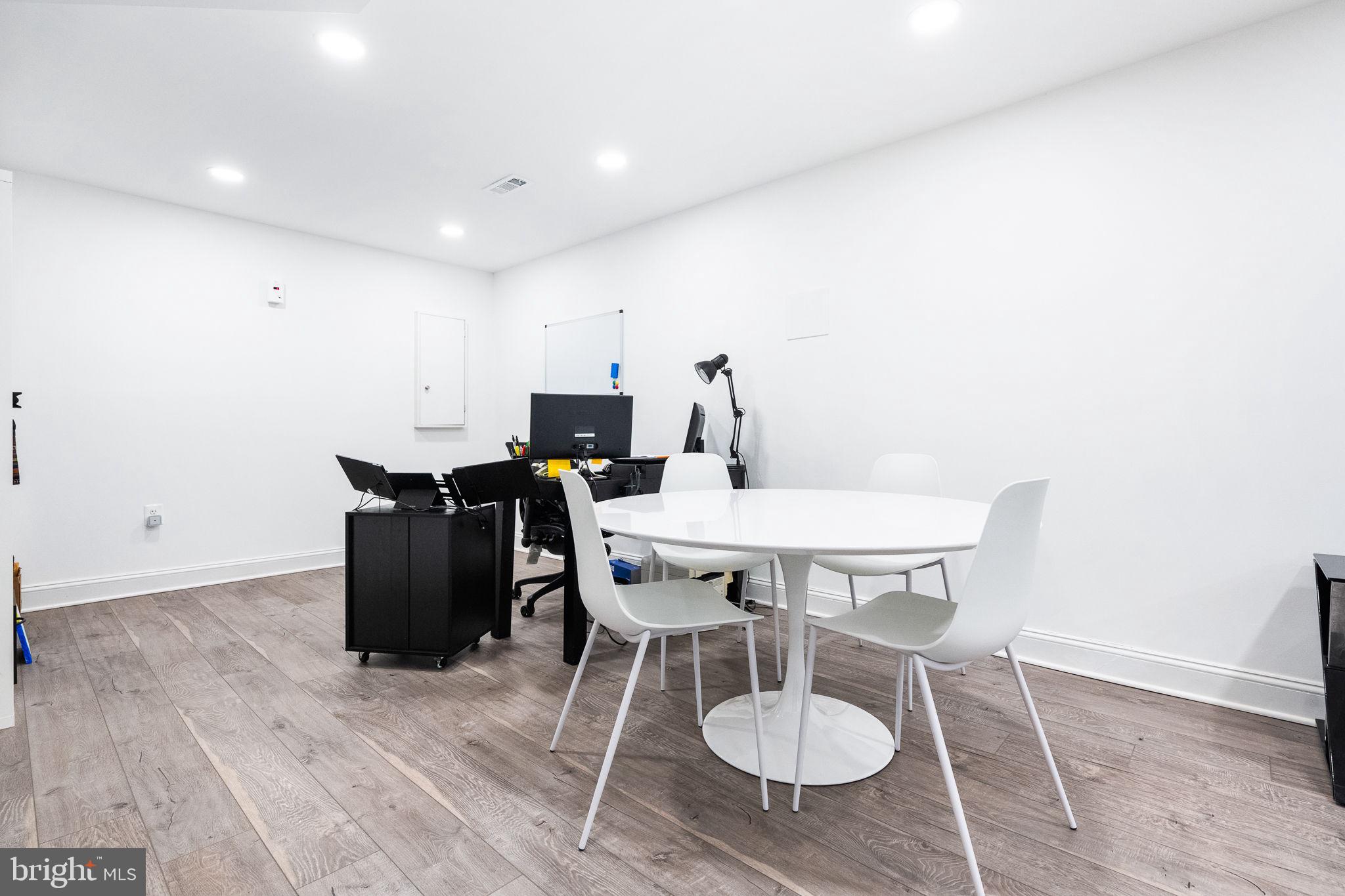 5020 River Road Bethesda, MD 20816 - Photo 25 of 35 a view of a table and chairs in wooden floor