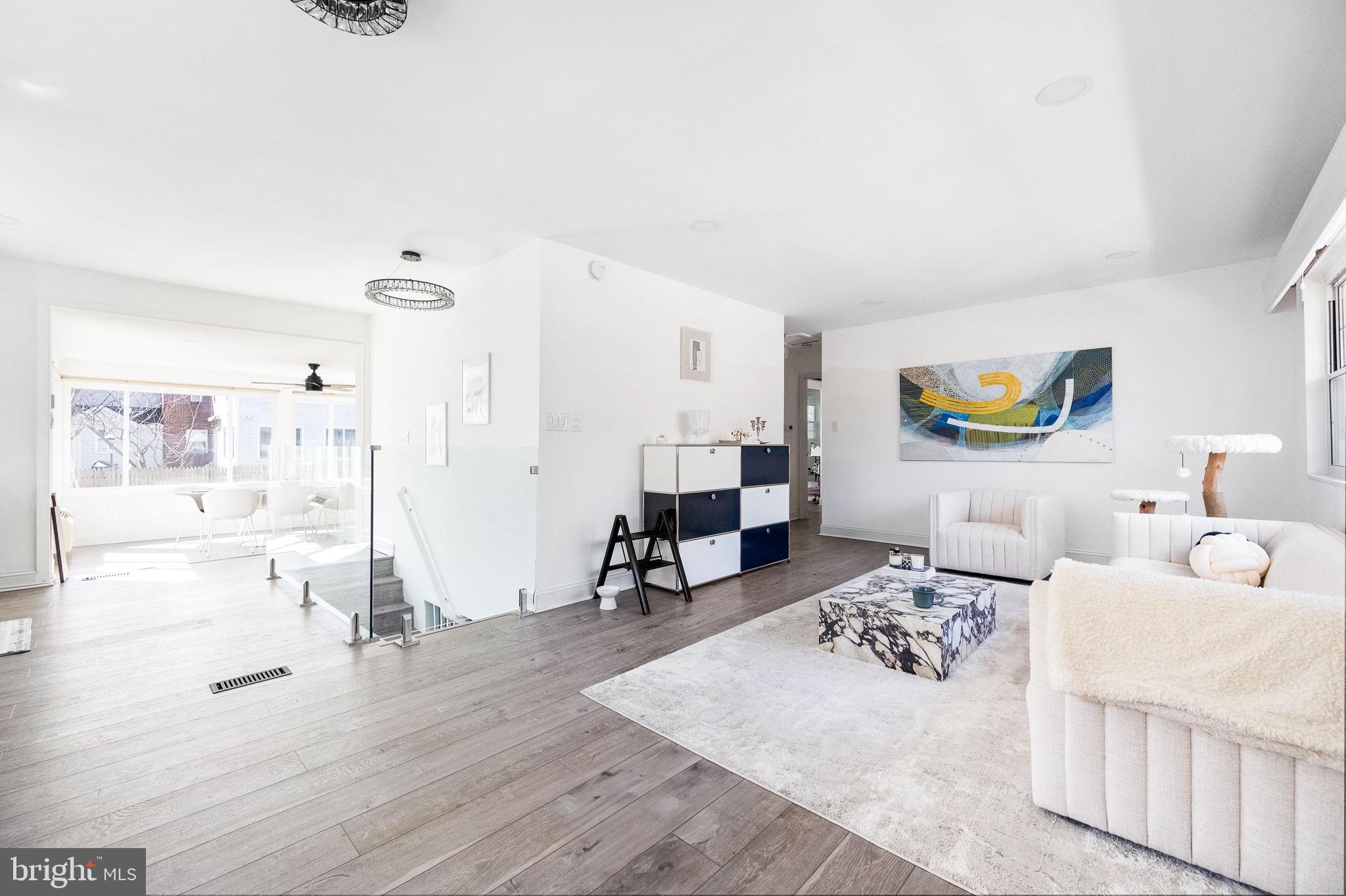 5020 River Road Bethesda, MD 20816 - Photo 7 of 35 a living room with furniture and a wooden floor