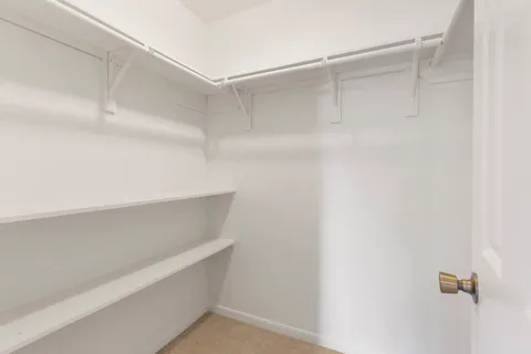 a view of an empty walk in closet