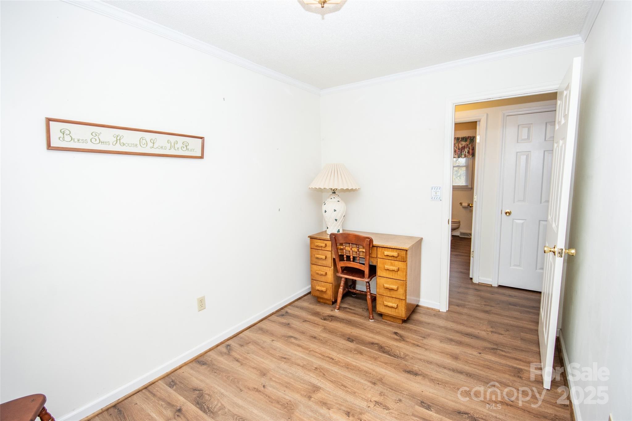 2890 Hobson Road Cleveland, NC 27013 - Photo 18 of 48 a view of a room with wooden floor and a bathroom