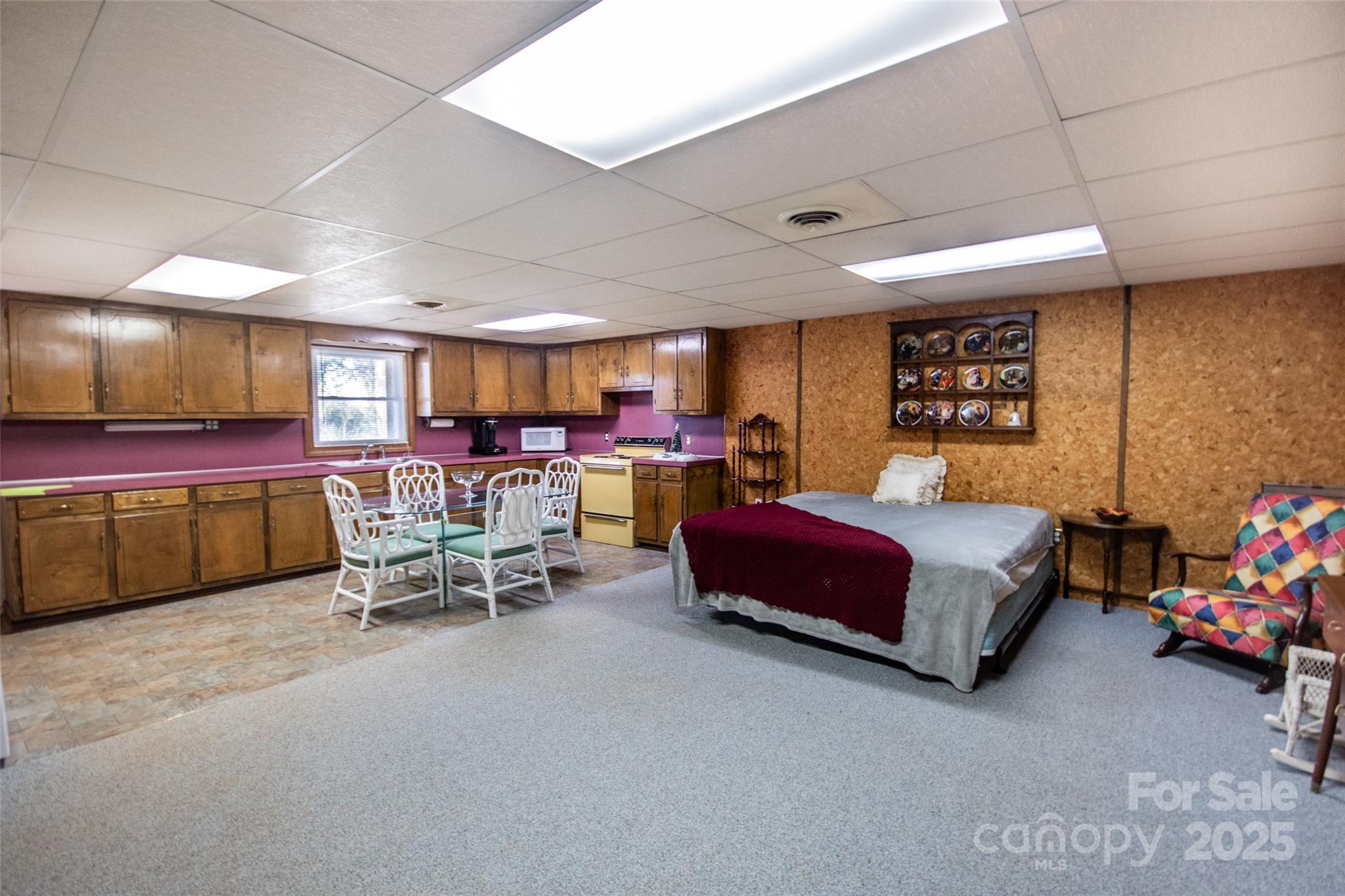 2890 Hobson Road Cleveland, NC 27013 - Photo 24 of 48 a bedroom with furniture and a large window