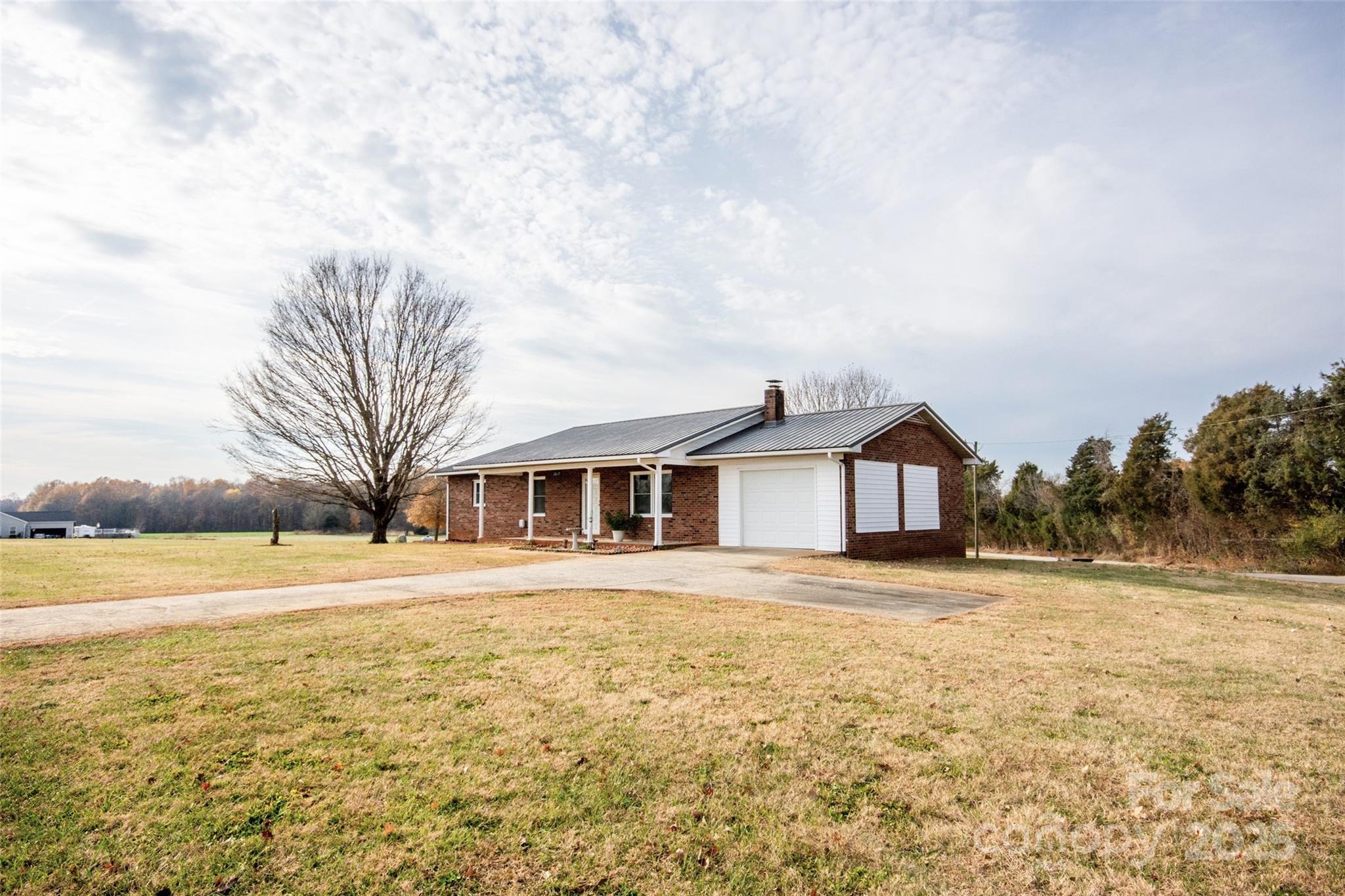 2890 Hobson Road Cleveland, NC 27013 - Photo 3 of 48 a view of a yard in front of a house with a yard