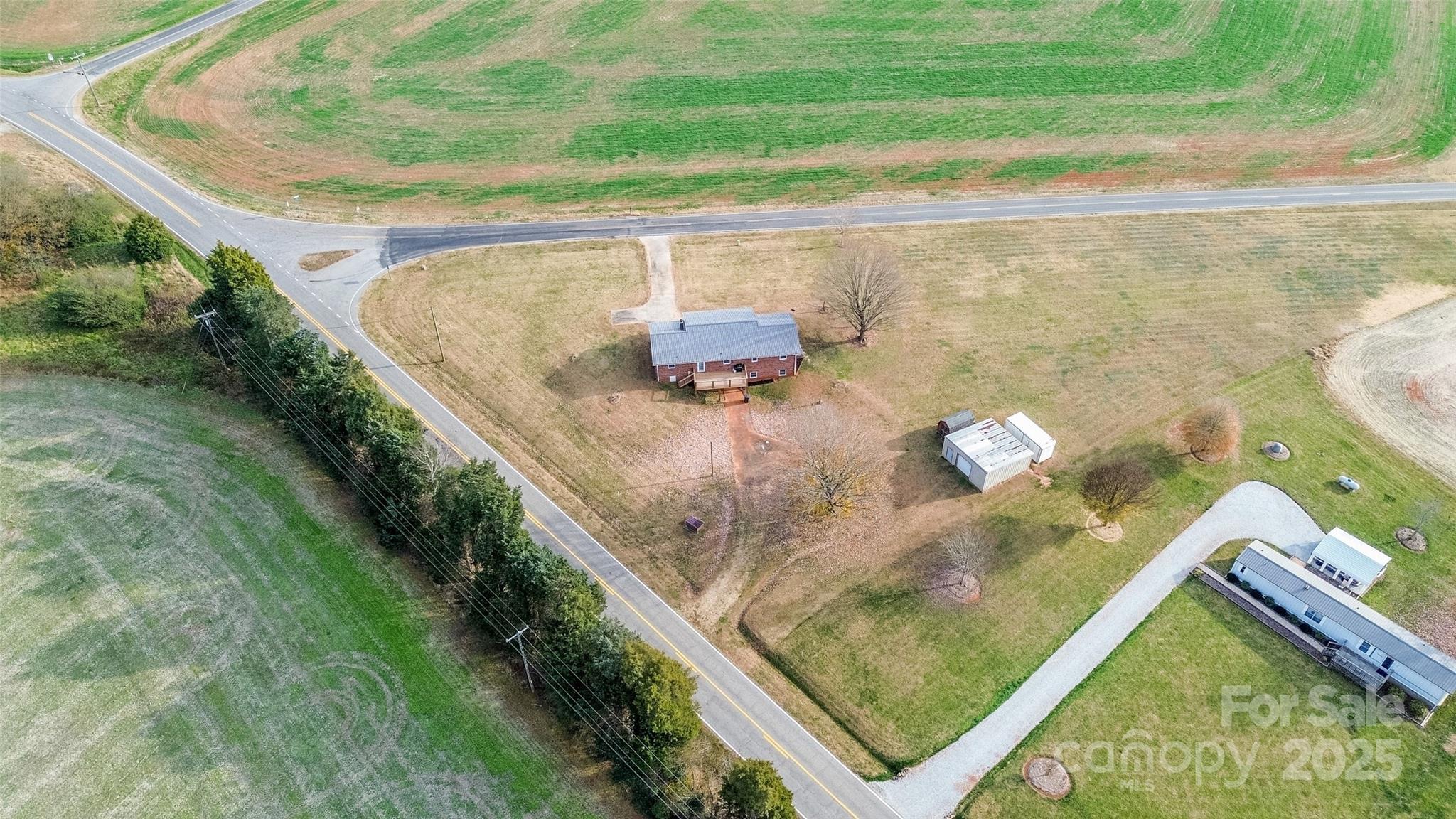 2890 Hobson Road Cleveland, NC 27013 - Photo 37 of 48 a picture of floor to ceiling window and outdoor