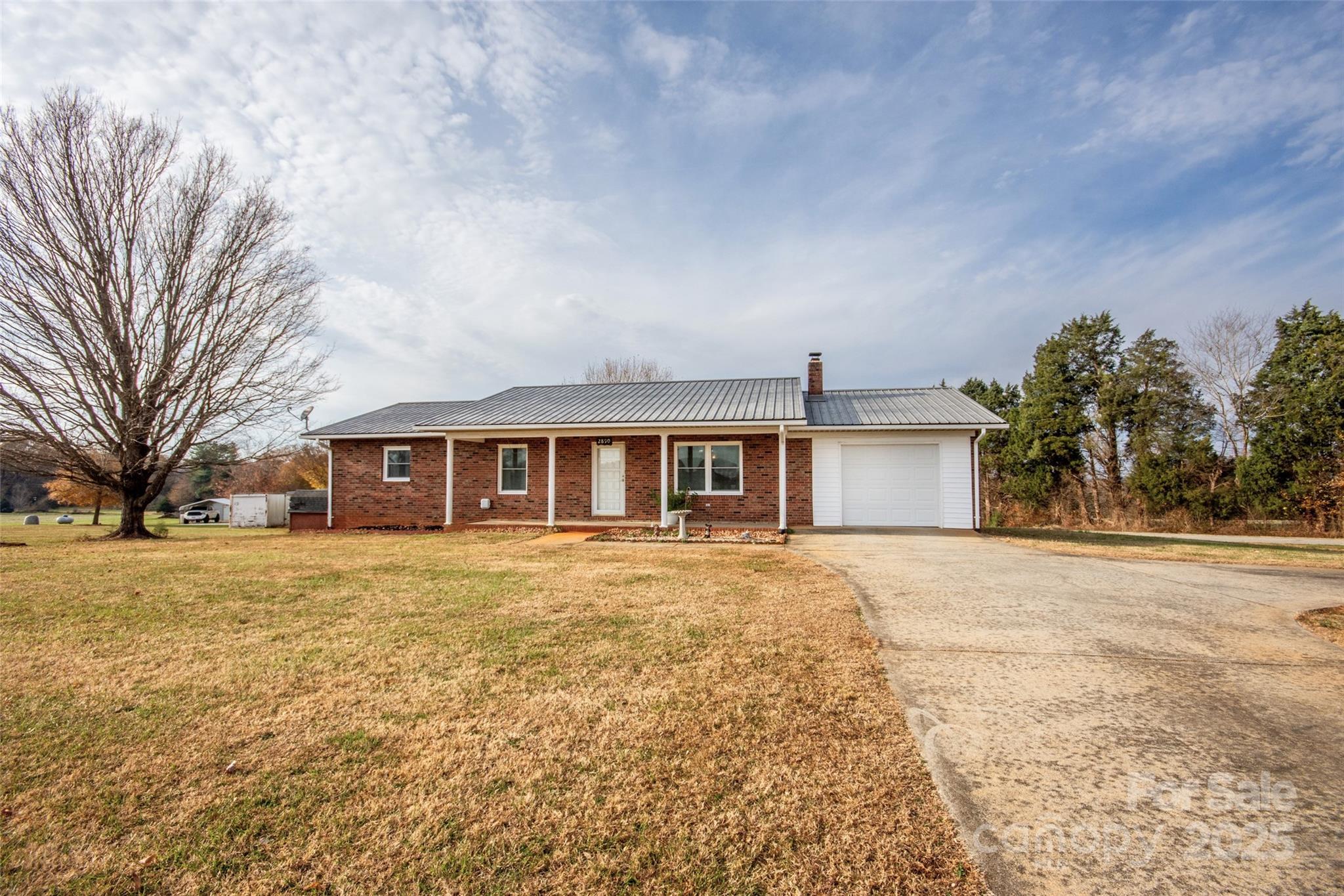 2890 Hobson Road Cleveland, NC 27013 - Photo 4 of 48 a front view of a house with a yard and trees