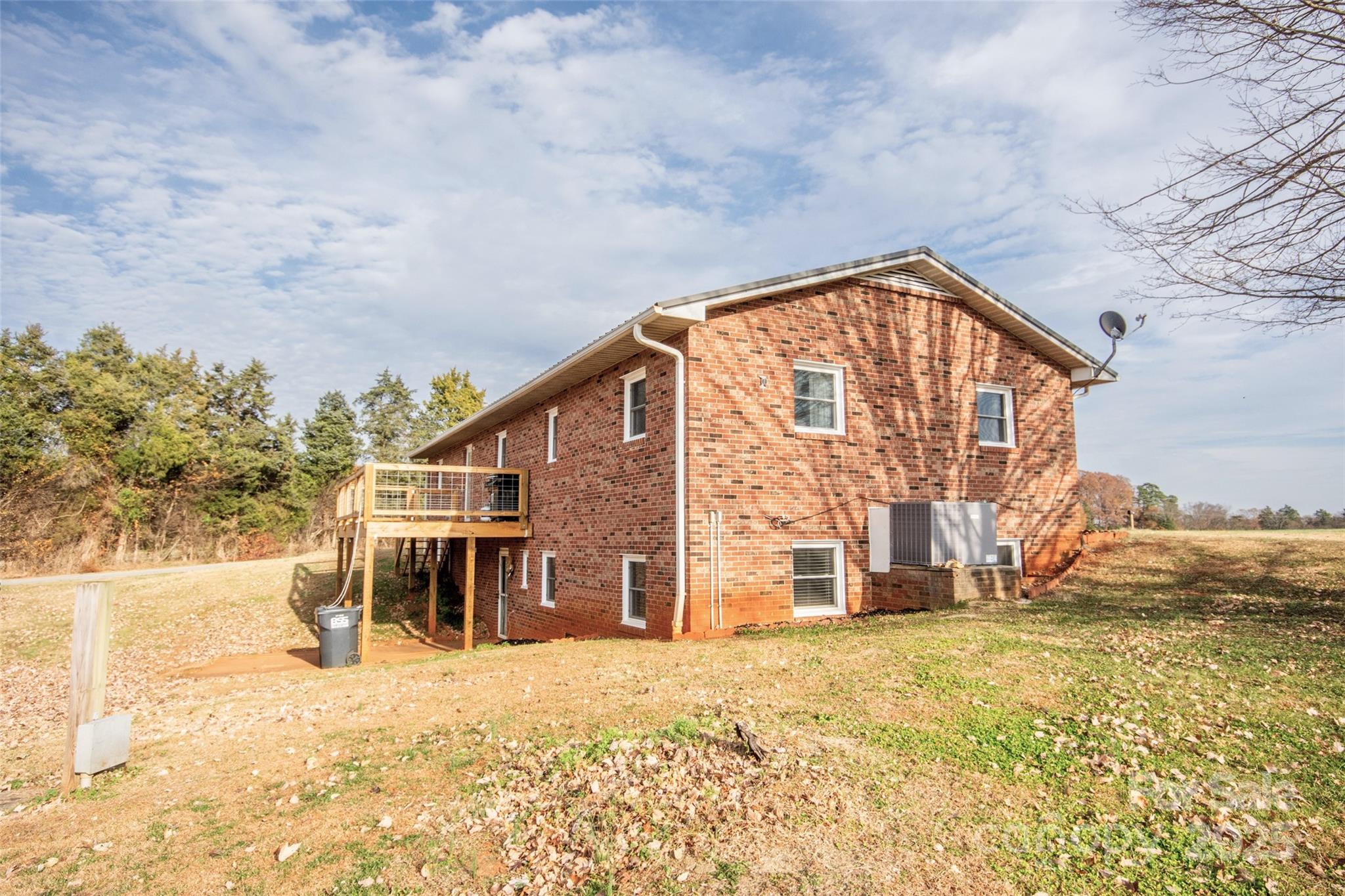 2890 Hobson Road Cleveland, NC 27013 - Photo 5 of 48 a view of a house with a backyard