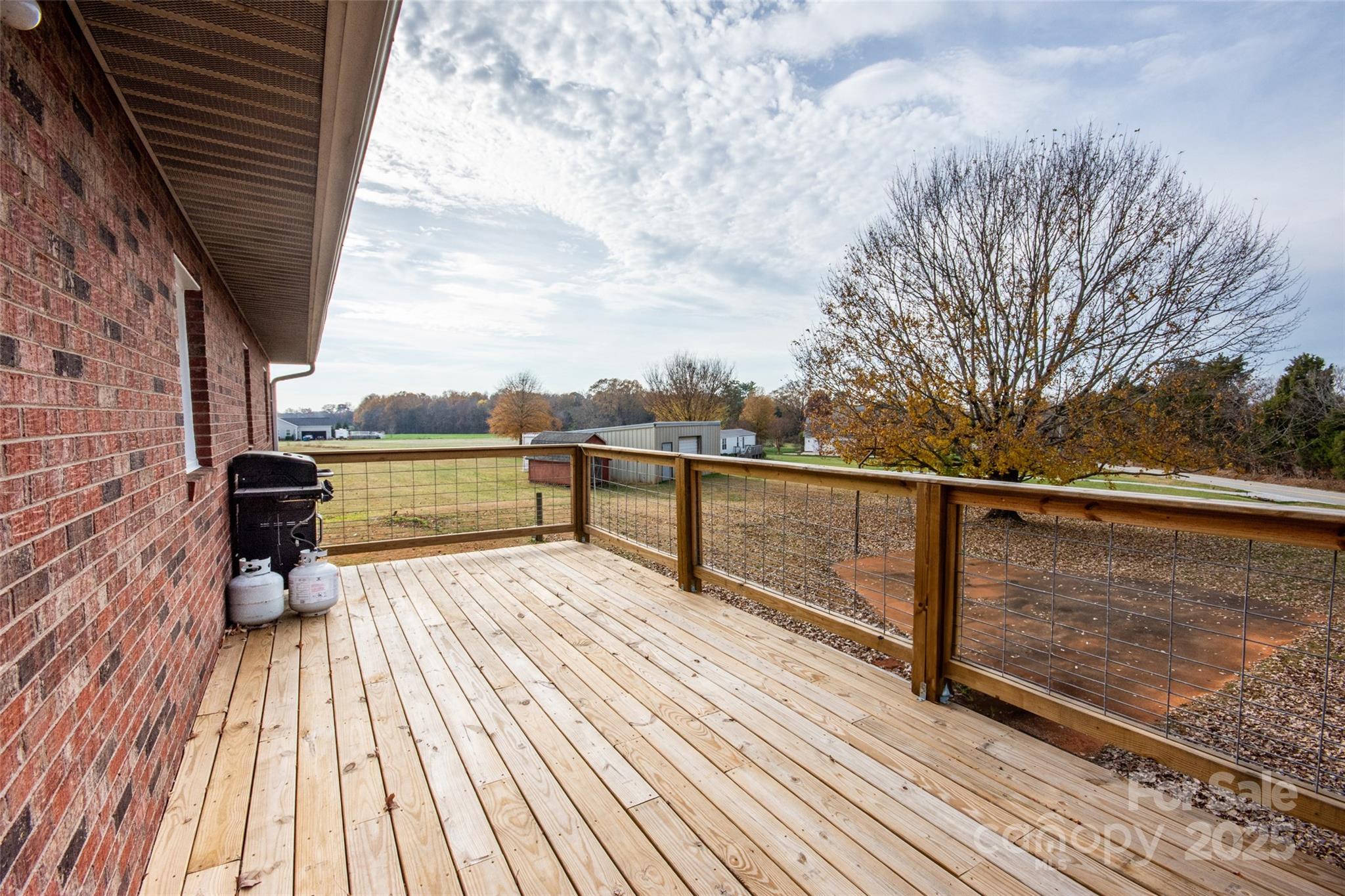 2890 Hobson Road Cleveland, NC 27013 - Photo 7 of 48 a view of balcony with wooden floor and fence