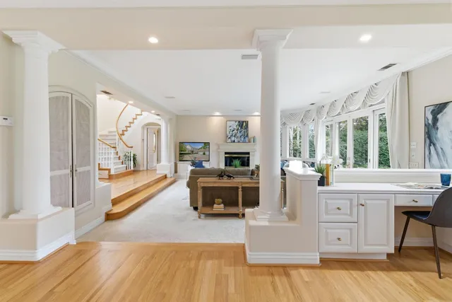 a view of a dining room with furniture and wooden floor