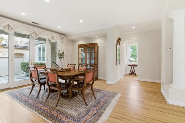 a kitchen with granite countertop white cabinets and stainless steel appliances