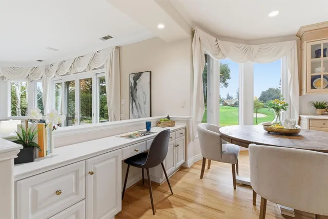 a spacious bedroom with a bed and a large window