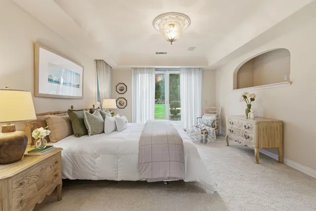 a aerial view of a house with a yard and potted plants