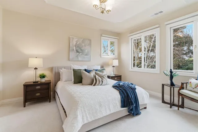 an aerial view of residential houses with outdoor space and street view