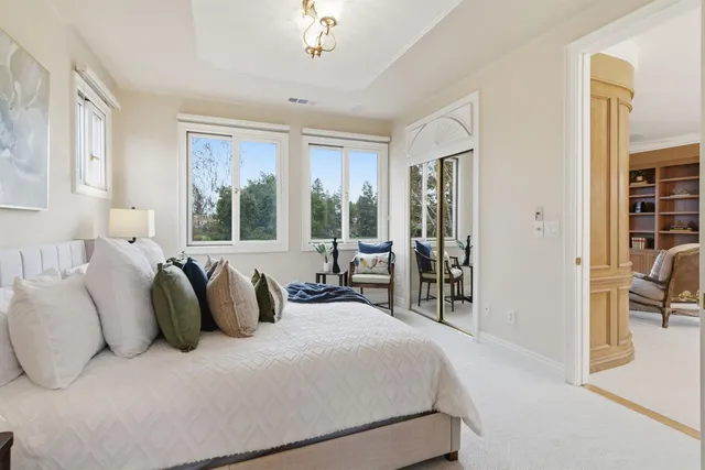 an aerial view of residential houses with outdoor space and river