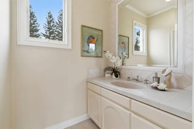 an aerial view of a house with a yard basket ball court