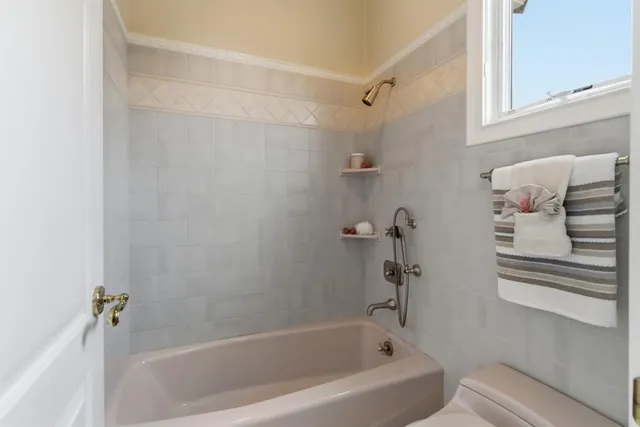 a front view of a house with a yard and outdoor seating