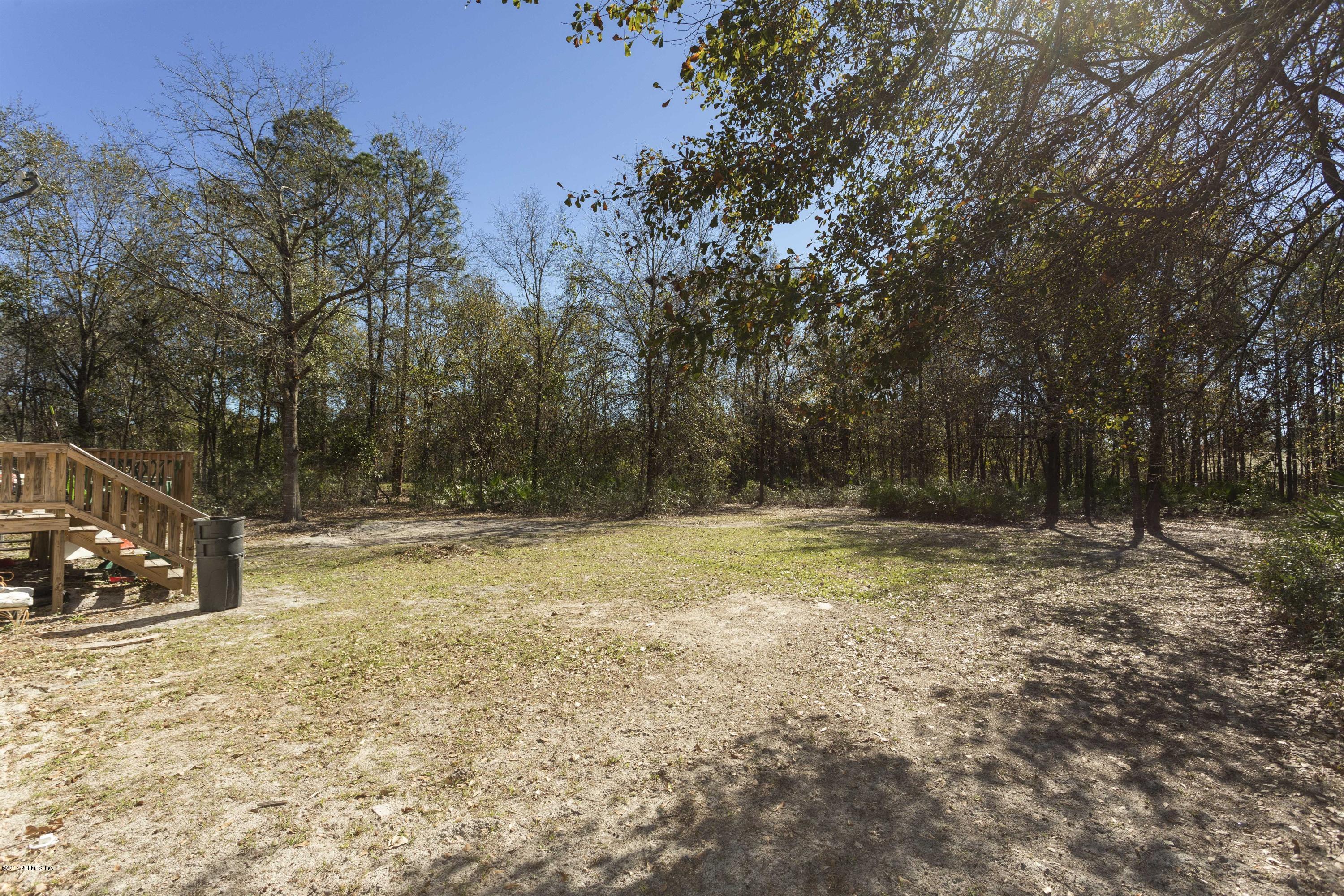 4049 Bronco Road Middleburg, FL 32068 - Photo 18 of 21 a view of a yard with trees