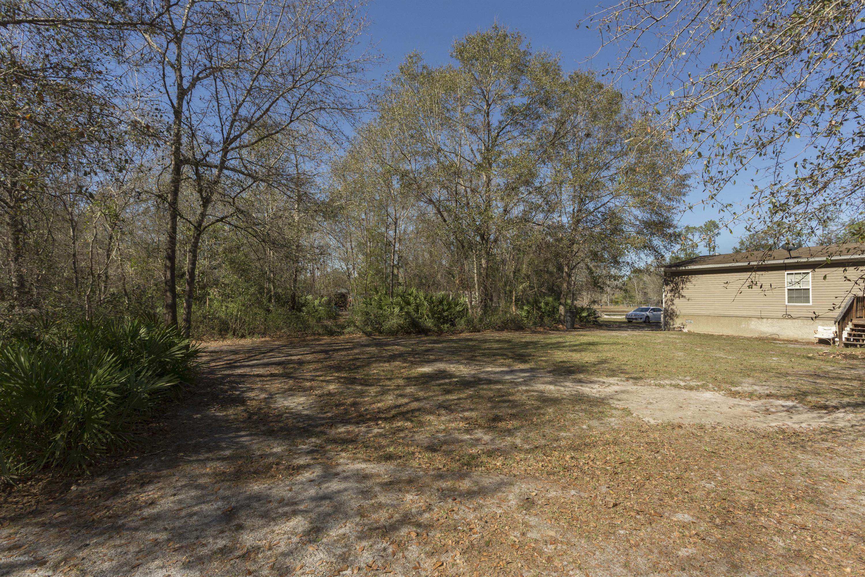 4049 Bronco Road Middleburg, FL 32068 - Photo 20 of 21 a view of a yard with an trees