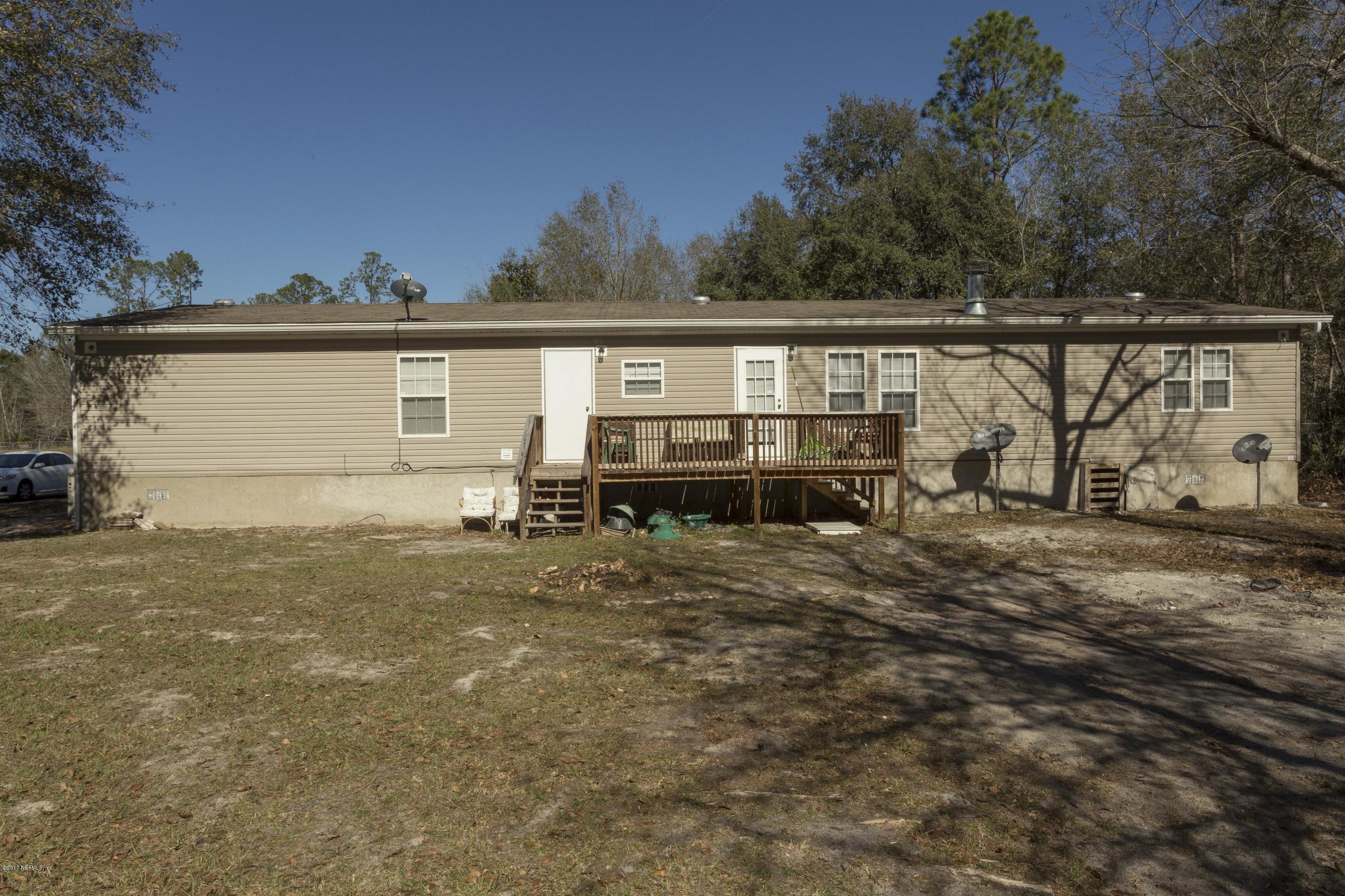 4049 Bronco Road Middleburg, FL 32068 - Photo 21 of 21 a view of a house with backyard and trees