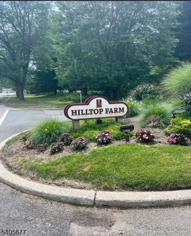 a view of a park that has a sign board