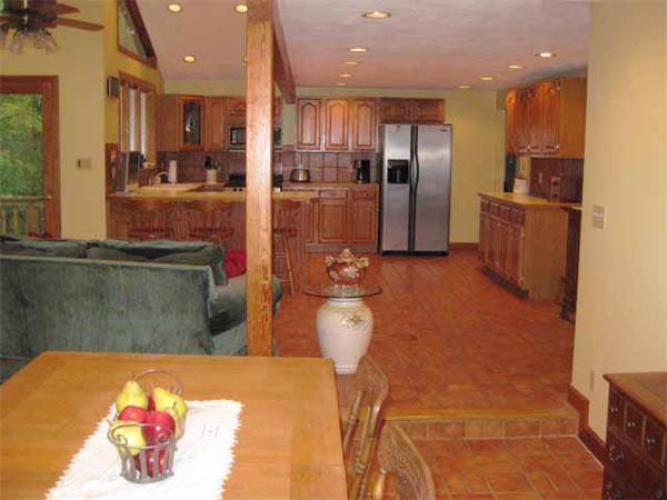 8 Amble Road Chelmsford, MA 01824 - Photo 5 of 15 a kitchen with stainless steel appliances wooden cabinets and a refrigerator