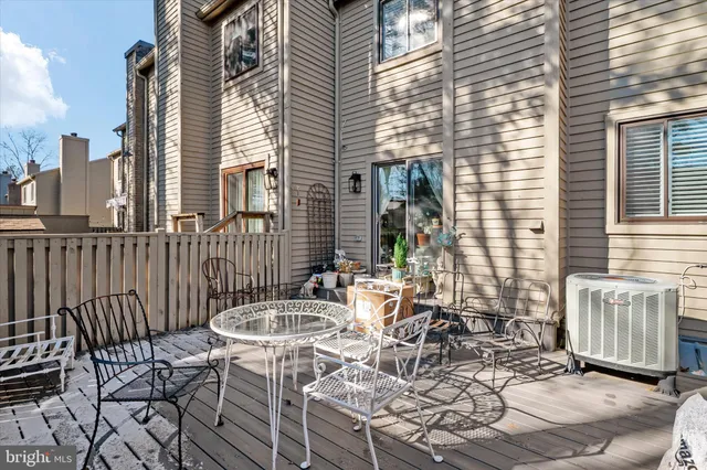 a view of a patio with table and chairs and potted plants