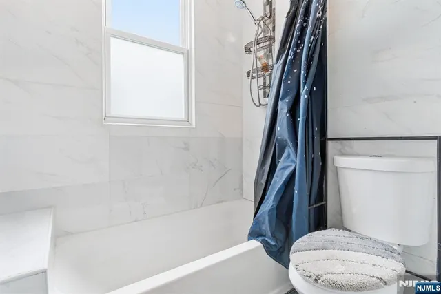 a room with a bed and a window