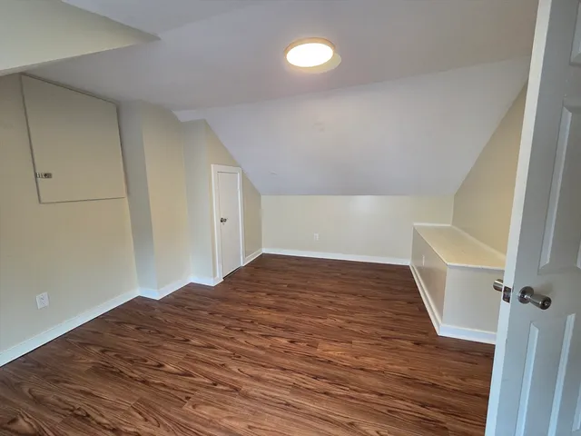 a view of empty room and wooden floor