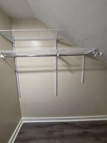 a view of an empty walk in closet