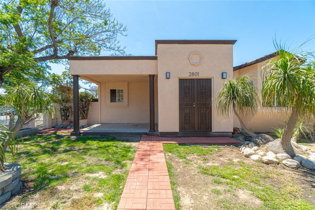 2801 Caspian Avenue Long Beach, CA 90810 - Photo 2 of 2 a front view of a house with garden