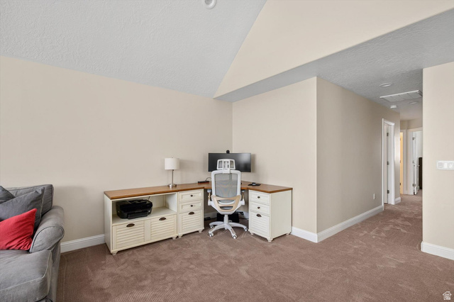 1456 Firelight Way Sandy, UT 84092 - Photo 10 of 22 Carpeted room with vaulted ceilings and neutral wall tones
