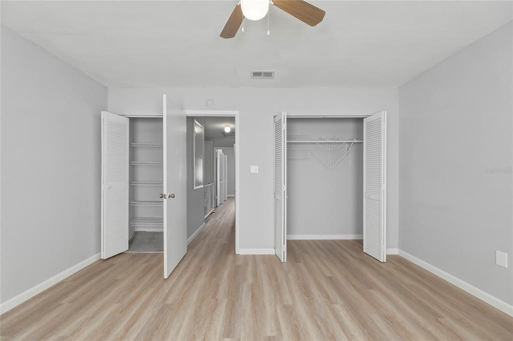 4799 Sisson Road Titusville, FL 32780 - Photo 20 of 23 an empty room with closet and a ceiling fan