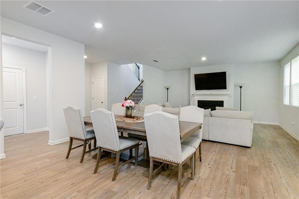 4774 Mock Orange Street Atlanta, GA 30331 - Photo 13 of 29 a view of a dining room with furniture and wooden floor
