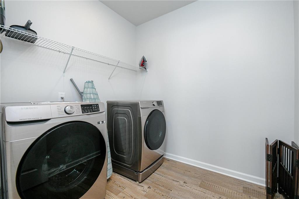 4774 Mock Orange Street Atlanta, GA 30331 - Photo 16 of 29 a utility room with dryer and washer