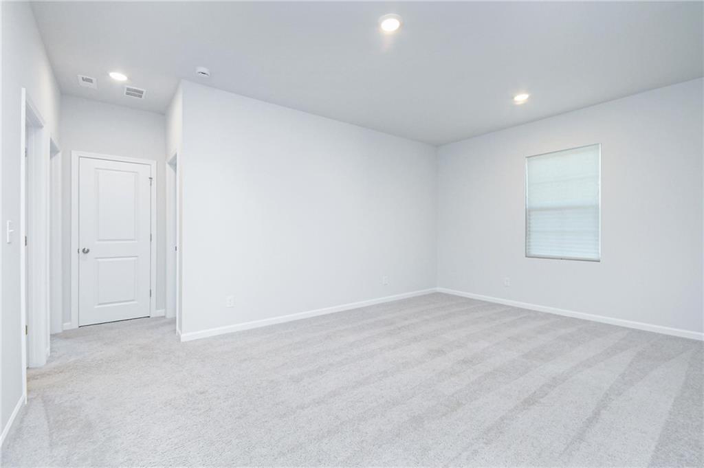 4774 Mock Orange Street Atlanta, GA 30331 - Photo 17 of 29 an empty room with a empty space and windows