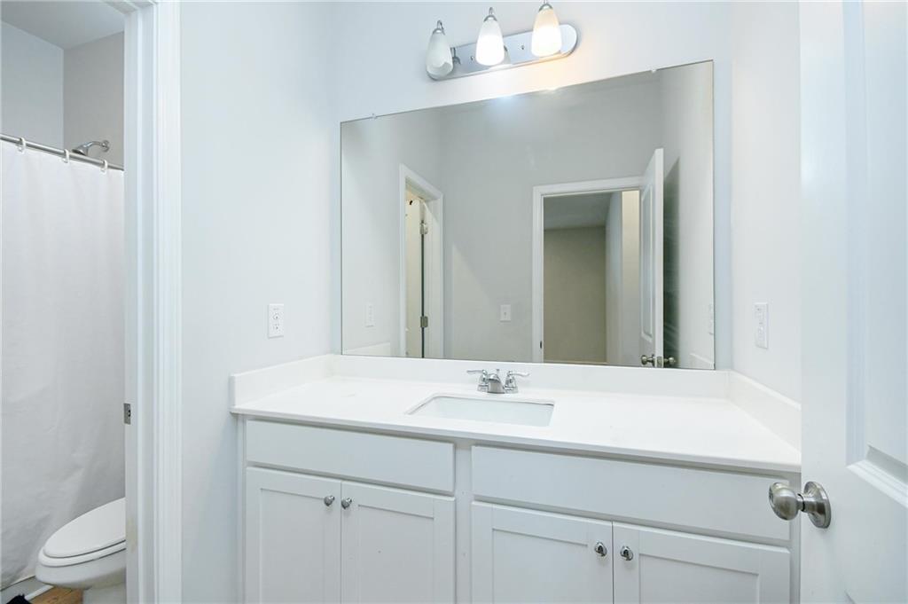4774 Mock Orange Street Atlanta, GA 30331 - Photo 20 of 29 a bathroom with a sink and a mirror