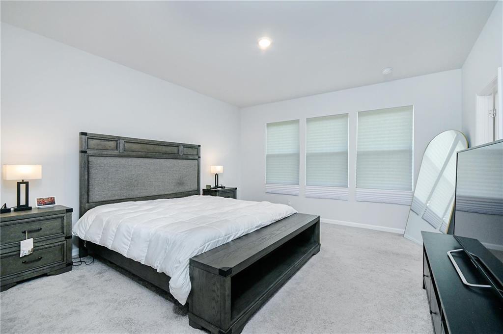 4774 Mock Orange Street Atlanta, GA 30331 - Photo 22 of 29 a bedroom with a bed and a large window